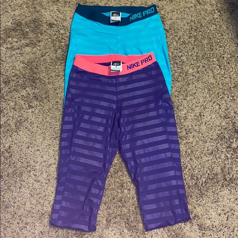 2 pairs of Nike Pro Leggings